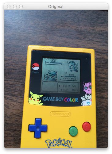 Figure 1: Our original Game Boy query image. Our goal is to find the screen in this image.