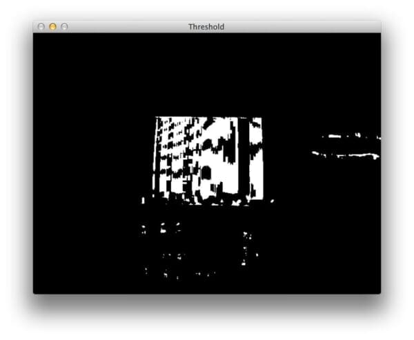 Figure 3: Thresholding the gradient image to obtain a rough approximation to the rectangular barcode region.