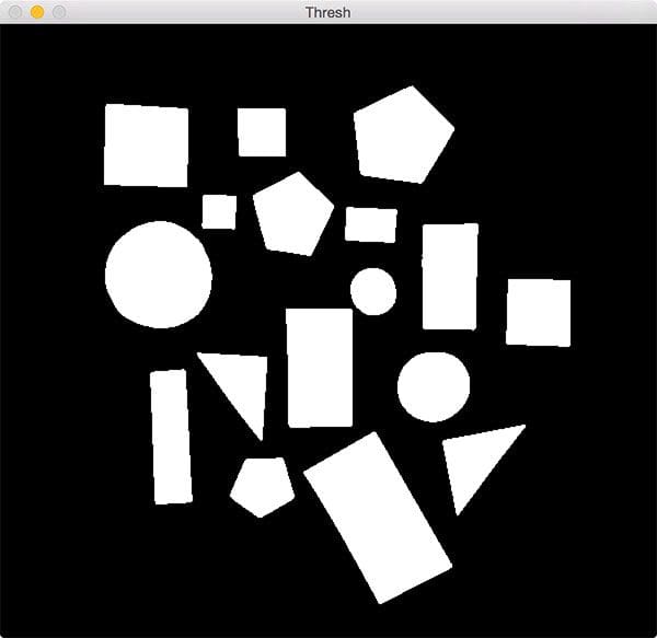 Figure 2: Thresholding our image returns a binary image, where the shapes appear as white on a black foreground.