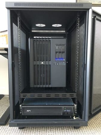 Figure 5: Fitting the UPS and DevBox into the rack.