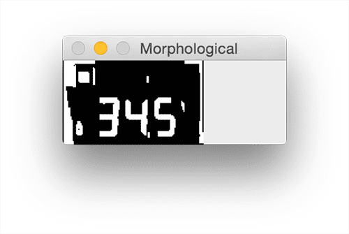 Figure 9: Applying a series of morphological operations cleans up our thresholded LCD and will allow us to segment out each of the digits.